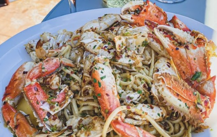 Sotto Mare signature dishes The Best Damn Crab CioppinoLobster RavioliLinguine with Seafood